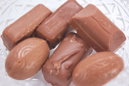 six chocolates in a dish closeup