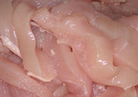 raw sliced chickenの写真素材