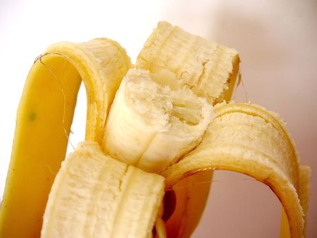 eaten banana in its skinの写真素材