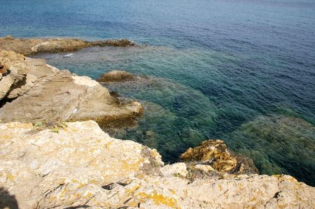 sea meeting the rocky coastlineの写真素材