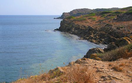 where the sea meets the cliffs along the coastlineの写真素材