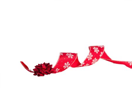 red christmas ribbon with a bowの写真素材