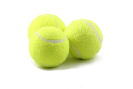 three tennis balls with a white backgroundの写真素材