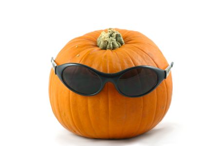whole large pumpkin dressed  with his  dark glassesの写真素材