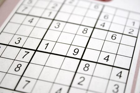shallow focus sudoku puzzle  in a book