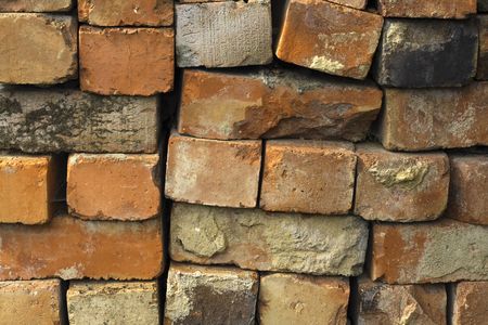 reclaimed bricks stacked ready to be cleaned and used for rebuilds