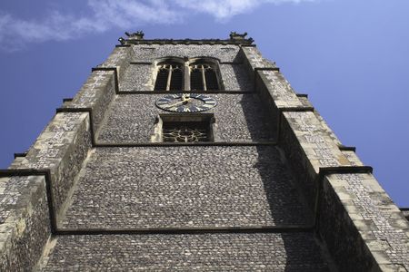 church tower taken directly from the foot of it towards the skyの写真素材