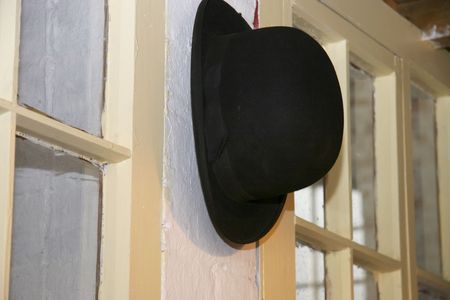 in the old days the supervisor wore a bowler hat, here it is hanging in his officeの写真素材