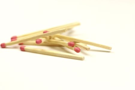 match sticks in a pile on white backgroundの写真素材