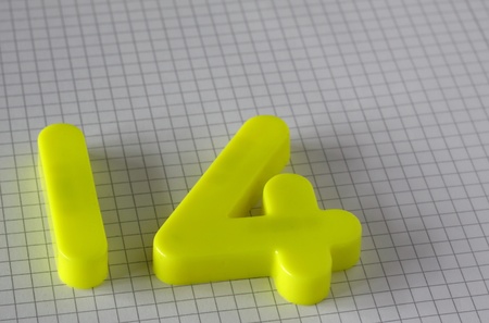 colourful number on white grid paper backgroundの写真素材