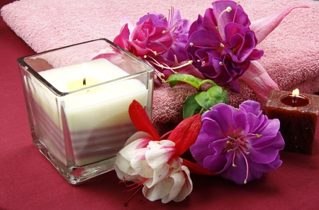 scented candles and beautiful flowers set the scene for a relaxation periodの写真素材