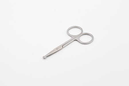 Silver metal scissors on a white background, Scissors for sewing on white background, Very sharp retro professional tailor scissorsの写真素材