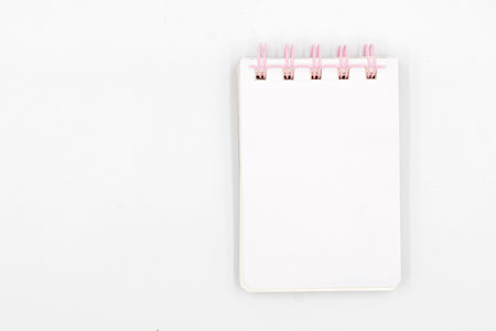 School notebook with pencil on white background