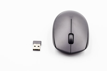 Black wireless mouse on white background, wireless computer mouse on white background.の写真素材