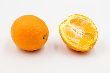 Fresh orange fruit isolate on white background, ripe orange isolated on white backgroundの写真素材