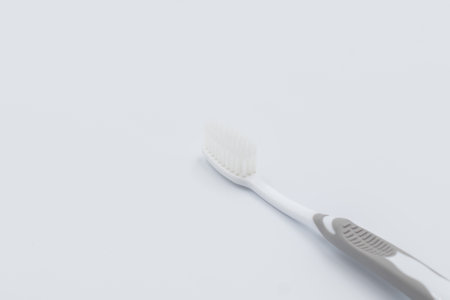 Plastic toothbrush on grey backgroundの写真素材