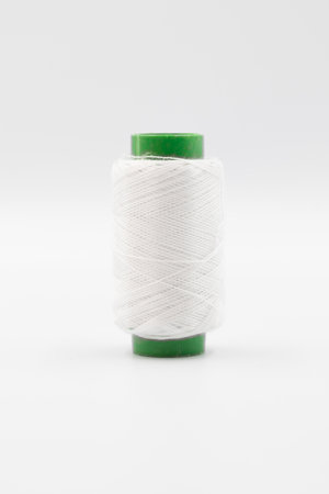 Colorful Spool of sewing thread, spool of industrial threads, Colored spools of thread on a white...