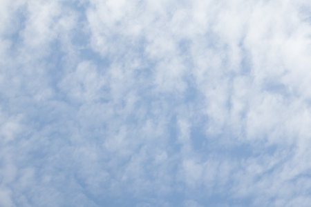 Blue sky background with tiny clouds, Nature cloud blue sky background, Blue Sky with Fluffy White Clouds on a Sunny Summer Dayの写真素材