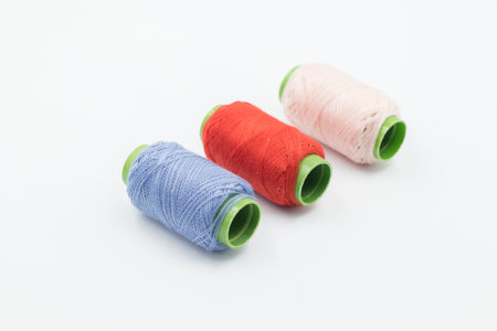 Colorful Spool of sewing thread, spool of industrial threads, Colored spools of thread on a white background.の写真素材