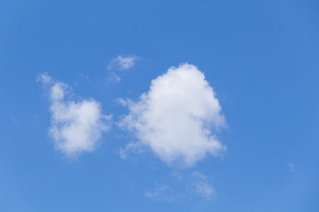 Blue sky background with tiny clouds, Nature cloud blue sky background, Blue Sky with Fluffy White Clouds on a Sunny Summer Dayの写真素材