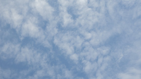 Blue sky background with tiny clouds, Nature cloud blue sky background, Blue Sky with Fluffy White Clouds on a Sunny Summer Dayの写真素材