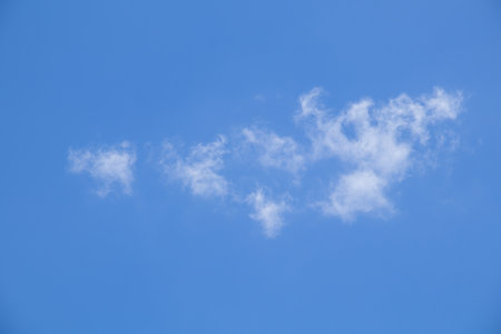 Blue sky background with tiny clouds, Nature cloud blue sky background, Blue Sky with Fluffy White Clouds on a Sunny Summer Dayの写真素材