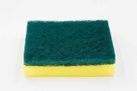 Yellow sponge, Cleaning concept, Yellow sponge for dishwashing on white background.の写真素材