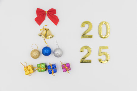 Gold 2025 numerals on a white background. 2025 New Years Eve Celebration, Holiday background Happy New Year 2025. Numbers of year 2025, celebrating New Year holiday, Space for textの写真素材