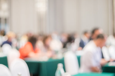 softly blurred view of a modern conference room filled with ambient lightingの写真素材
