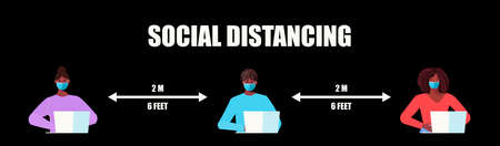 Young african american people working at the computer, keeping a social distance. Practice social...