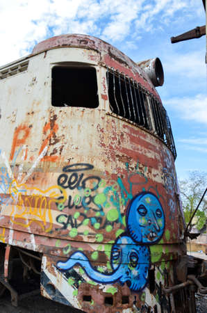 Abandoned old train with rust and graffitis