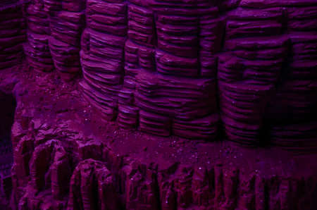 Dark mountain texture in purple color background
