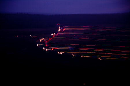 Blurred colorful light bokeh in dark nightの写真素材