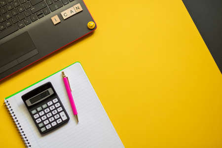 Office desk seen from above. Flat desk. Workspace, keyboard, office supplies, pencil, white sheet...