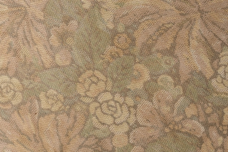 Fragment of grunge retro fabric pattern with floral rose vintage design as background.の写真素材