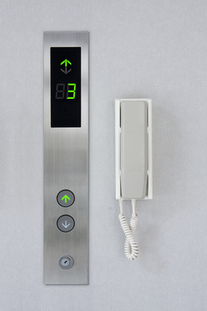 Press the elevator and elevator emergency phone.の写真素材