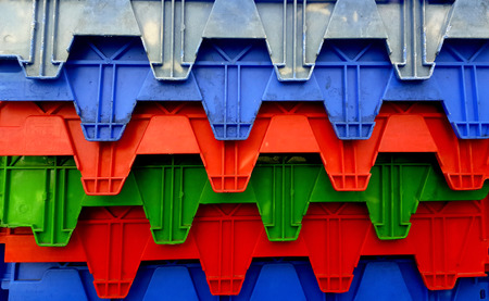 Plastic crates and boxes at transportation palletの写真素材