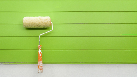 Roller, paint the wall greenの写真素材