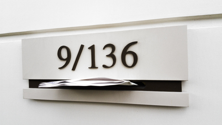 Metal mail box on concrete wall buildingの写真素材