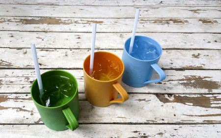 plastic cups isolated on background old woodの写真素材