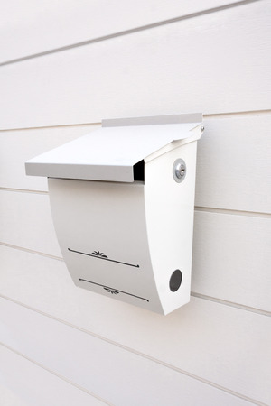 Metal mailbox and modern concrete wall backgroundの写真素材