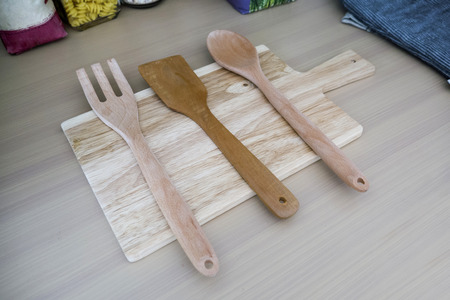Various wooden kitchen utensils on table top viewの写真素材