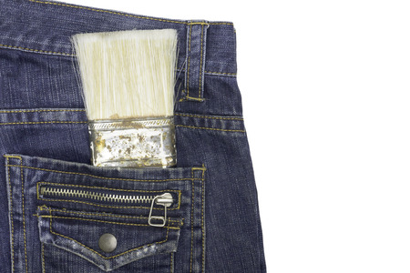 Paintbrush in the pocket of jeansの写真素材