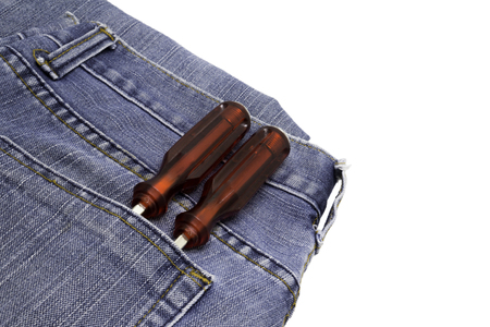 Red screwdriver in jeans pocket artisans.の写真素材