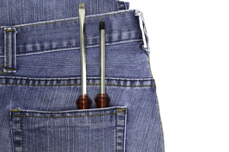 Red screwdriver in jeans pocket artisans.の写真素材