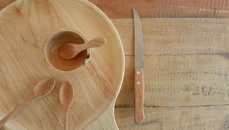 plate cup and spoon empty make with wooden top view on wooden backgroundの写真素材
