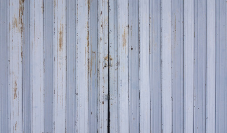 Old rusty iron slide doorの写真素材