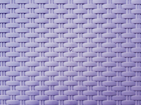 Synthetic rattan texture weaving background as used on outdoor garden furniture.