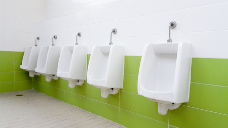Urinals in public toiletの写真素材