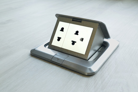 Electricity supply on wooden floor.の写真素材